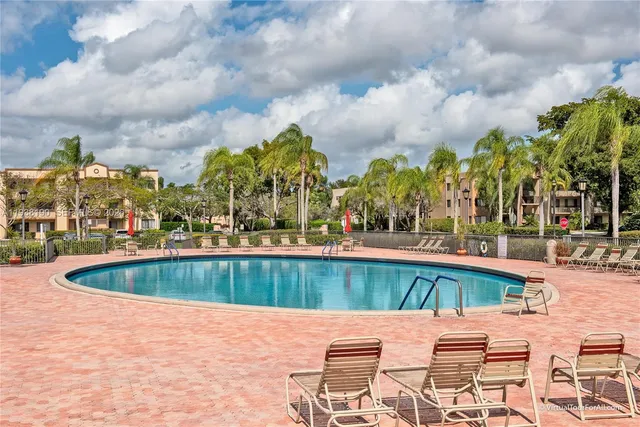 a view of sign board with flower around