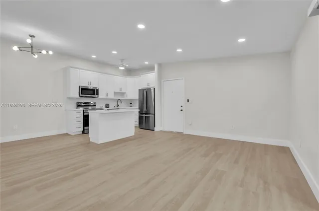 a view of kitchen with wooden floor
