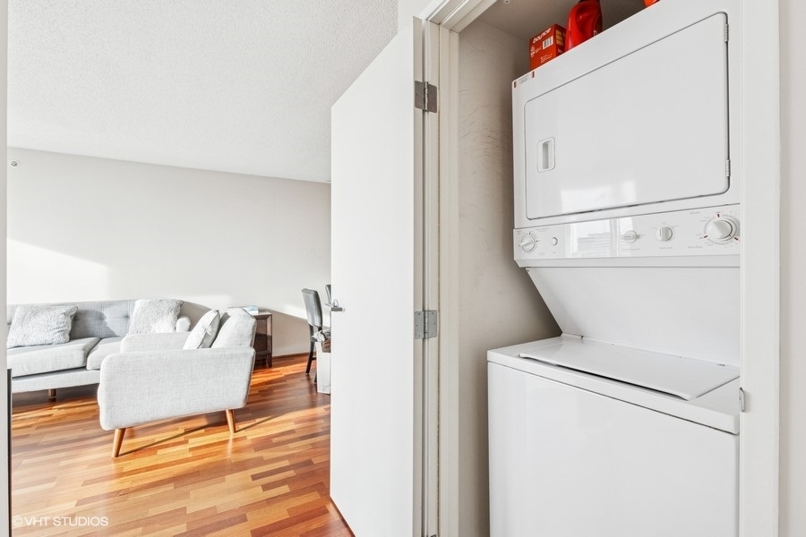 800 Elgin Road, Unit 1502 Evanston, IL 60201 - Photo 14 of 19 view of living room with furniture and wooden floor