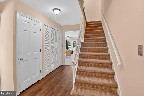 a view of an entryway with wooden floor