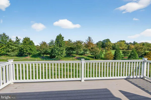 a balcony with wooden floor