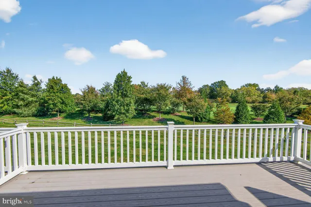 a balcony with wooden floor