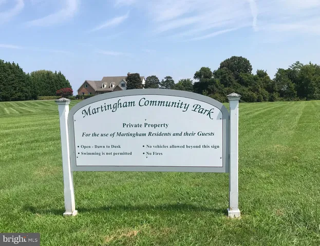 a view of a sign board with a big yard