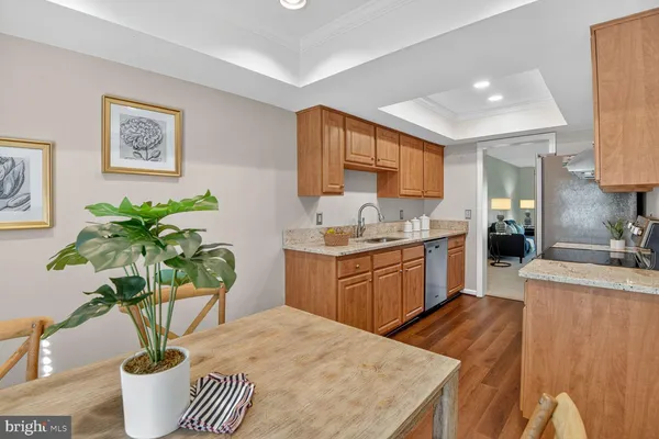 a kitchen with a table and chairs