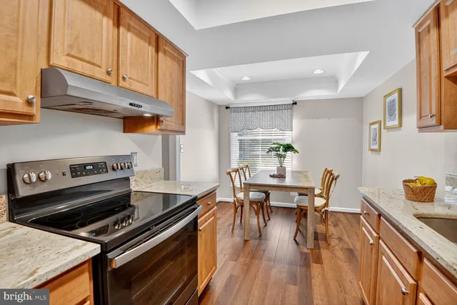 a kitchen with a table chairs and a stove