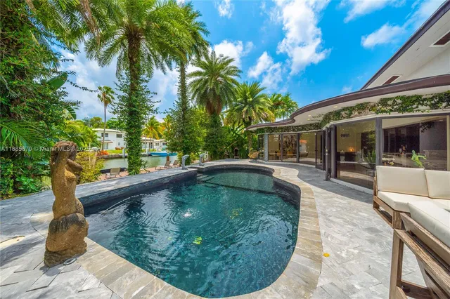 a view of a swimming pool with a patio