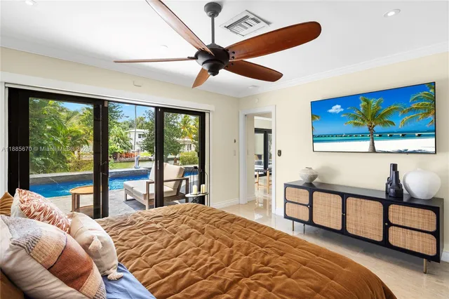 a bedroom with furniture and large window