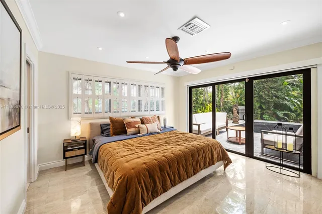 a bedroom with a large bed and a large window