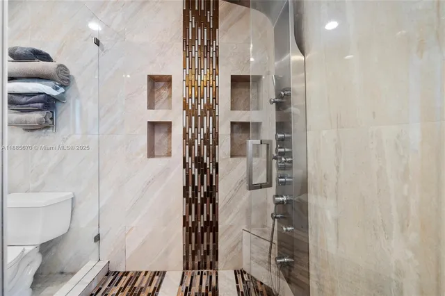 a bathroom with a shower and a toilet