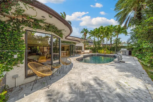 a view of a swimming pool with a patio