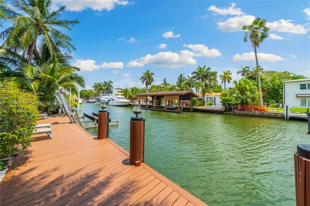 a view of a lake with a house in the background