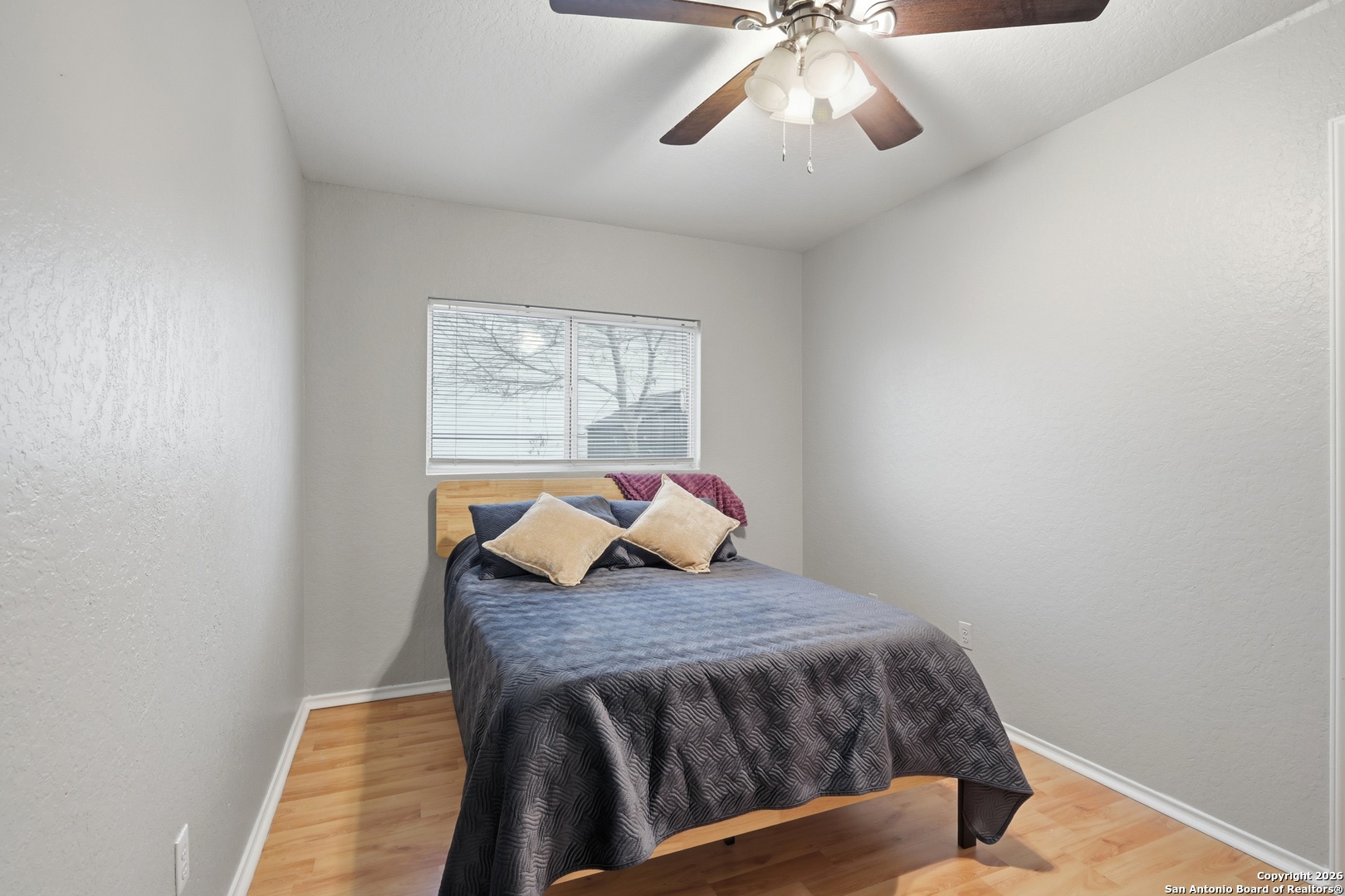814 Inks Farm San Antonio, TX 78228 - Photo 22 of 32 a bedroom with a bed and window