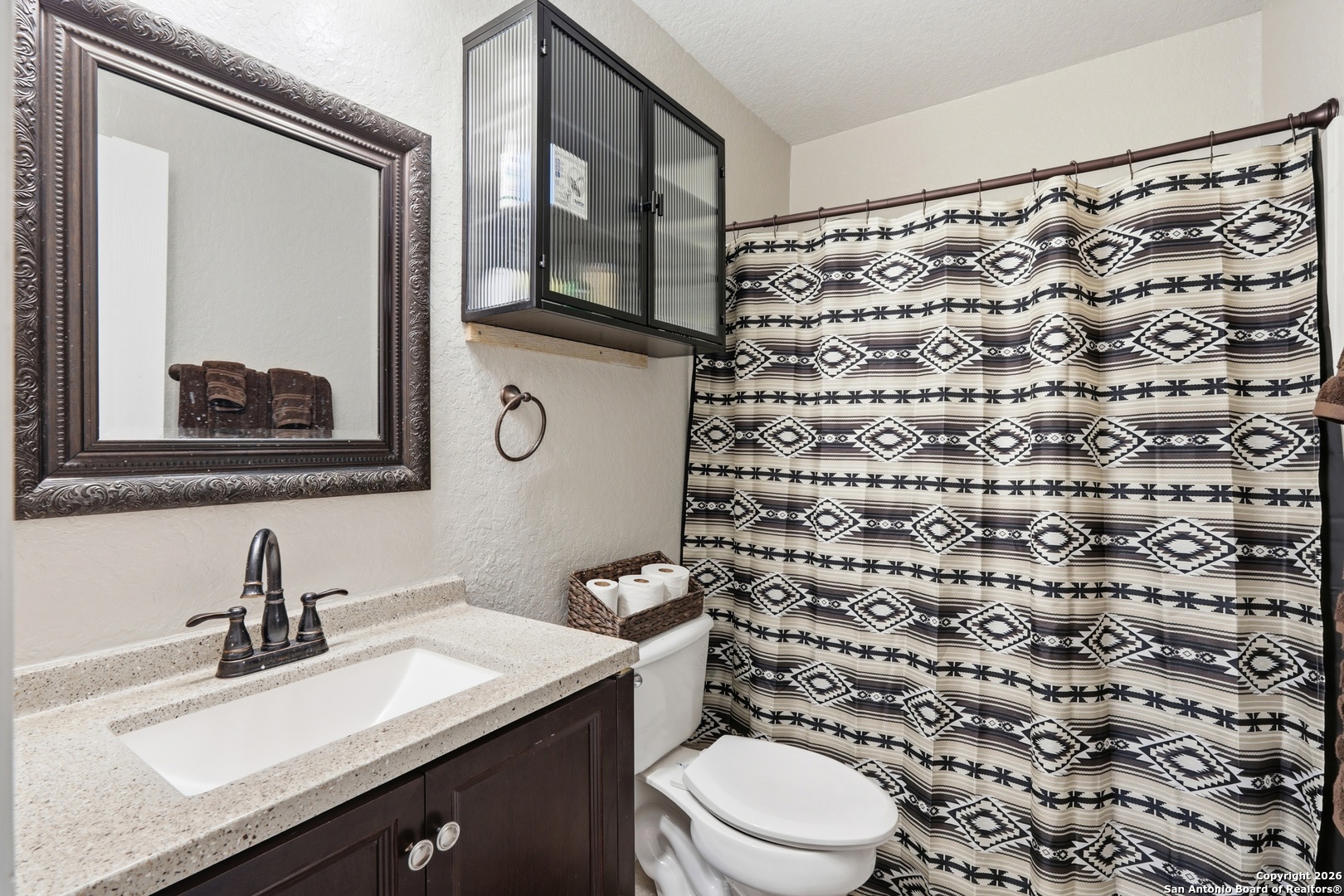 814 Inks Farm San Antonio, TX 78228 - Photo 24 of 32 a bathroom with a sink and a mirror