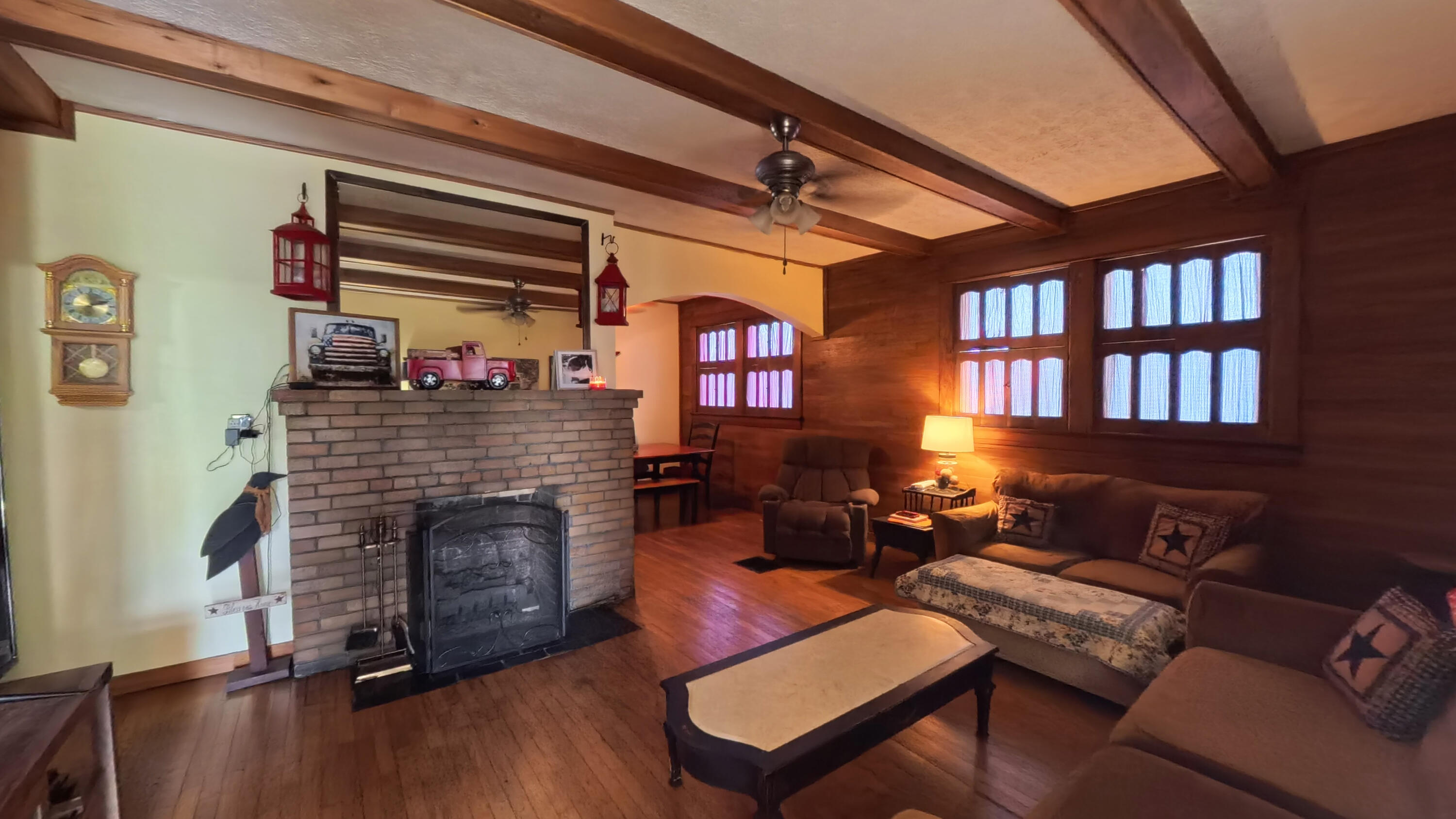 413 Elm Street Ravenna, KY 40472 - Photo 10 of 42 Gas fireplace and shuttered windows add to the cozy feeling!