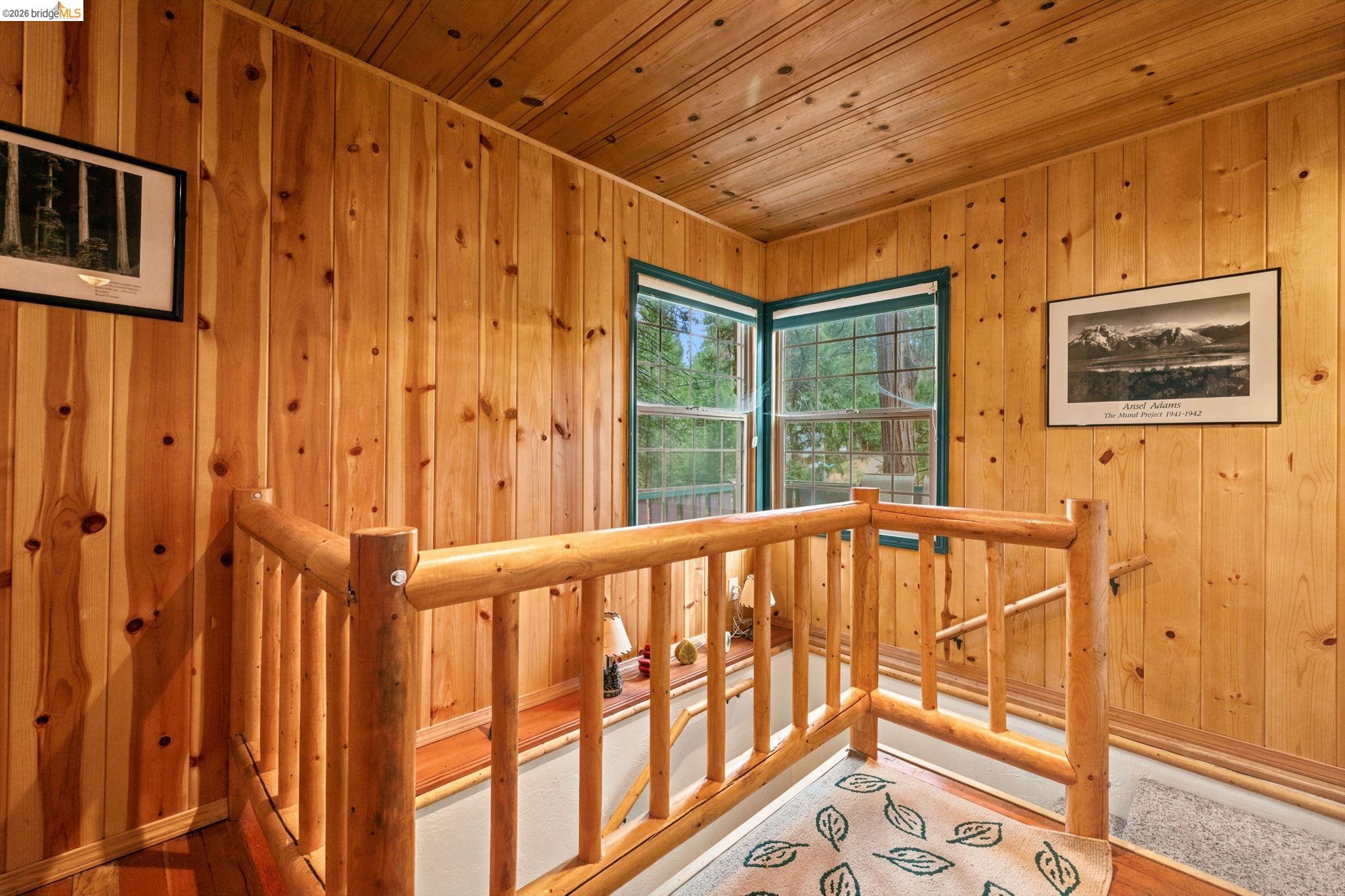 25822 Long Barn Sugar Pine Road Long Barn, CA 95335 - Photo 18 of 28 a view of a balcony with furniture and floor to ceiling windows