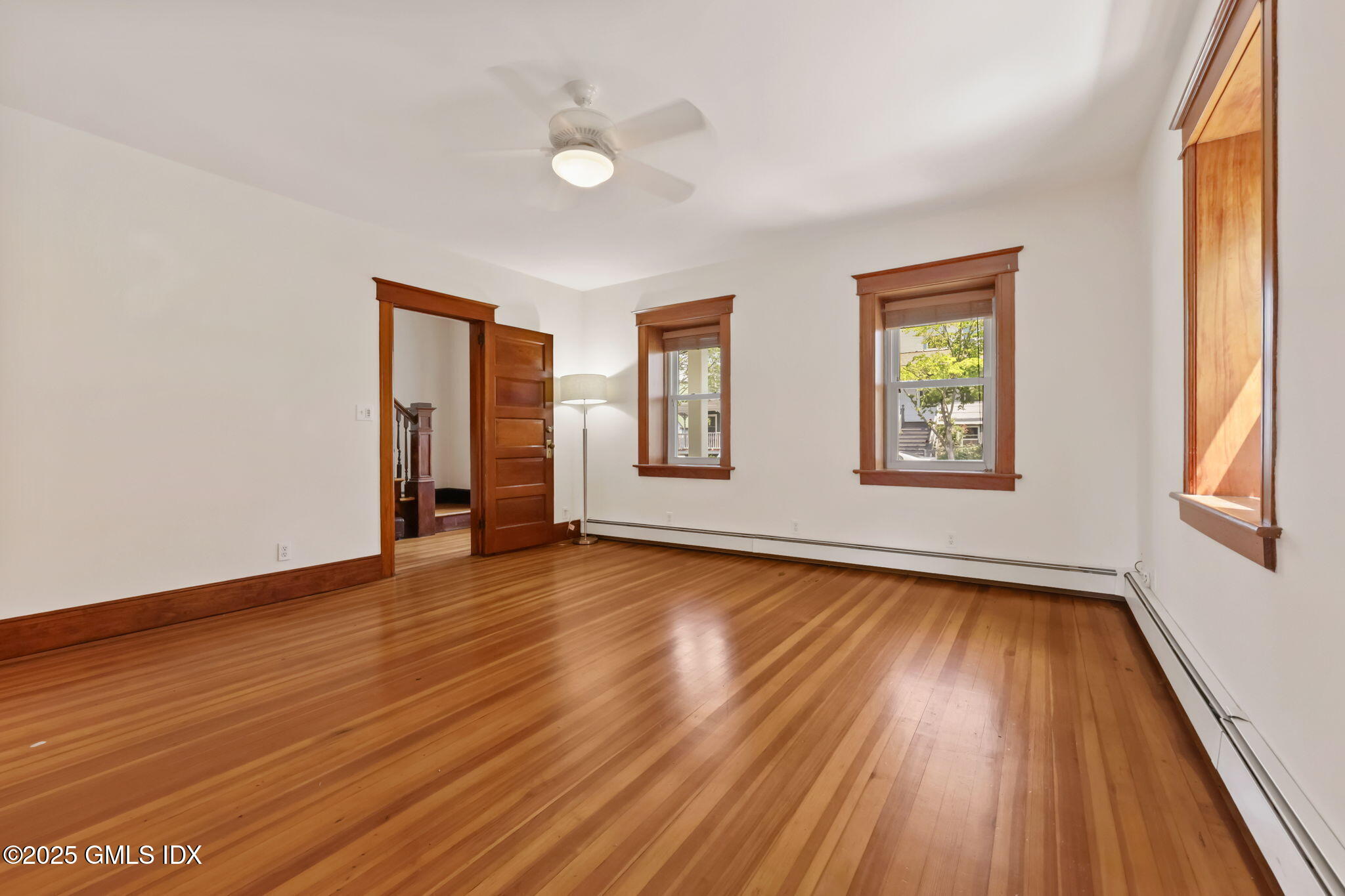 20 Church St W Greenwich, CT 06830 - Photo 13 of 31 a view of a room with wooden floor and window