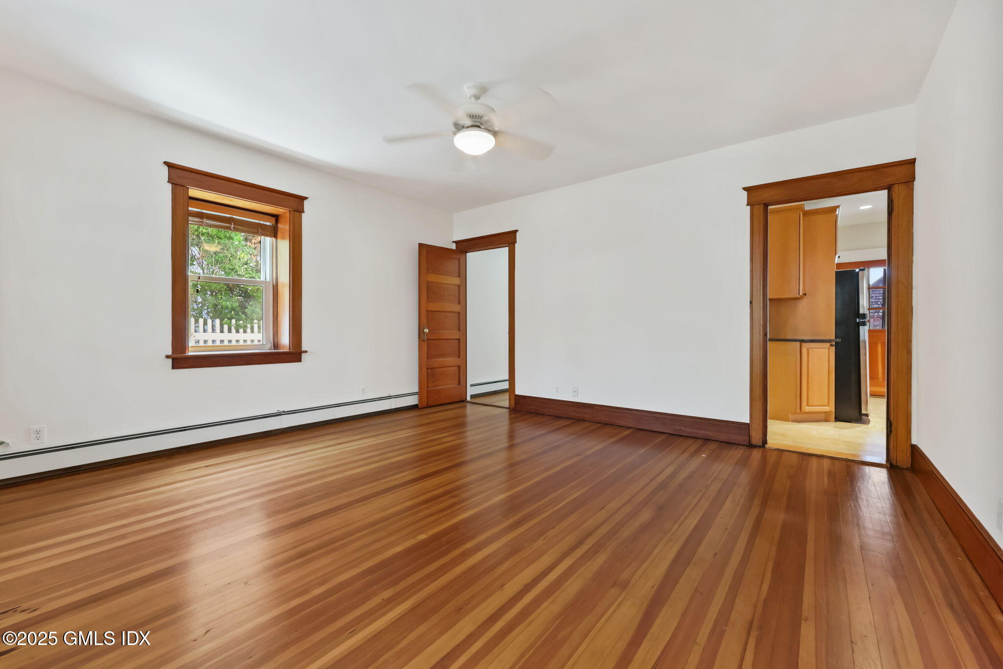 20 Church St W Greenwich, CT 06830 - Photo 14 of 31 a view of an empty room with wooden floor and a window