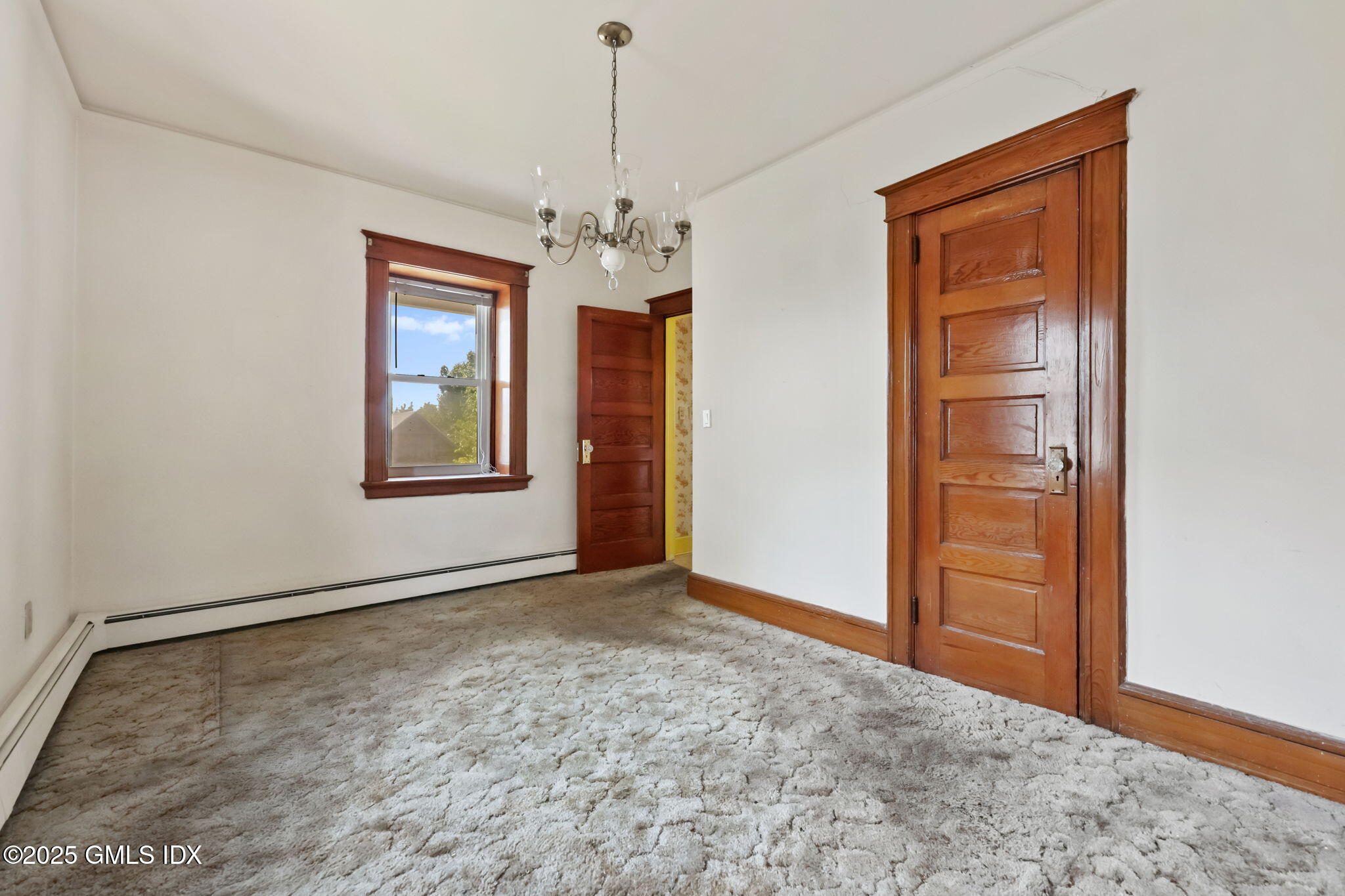 20 Church St W Greenwich, CT 06830 - Photo 19 of 31 an empty room with windows and closet