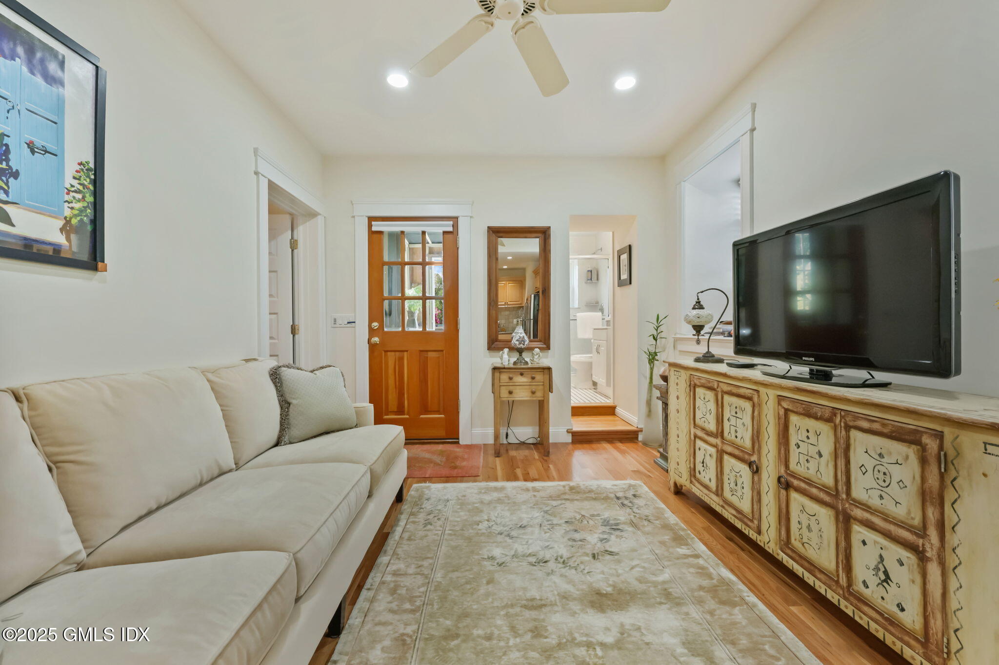 20 Church St W Greenwich, CT 06830 - Photo 7 of 31 a living room with furniture and a flat screen tv
