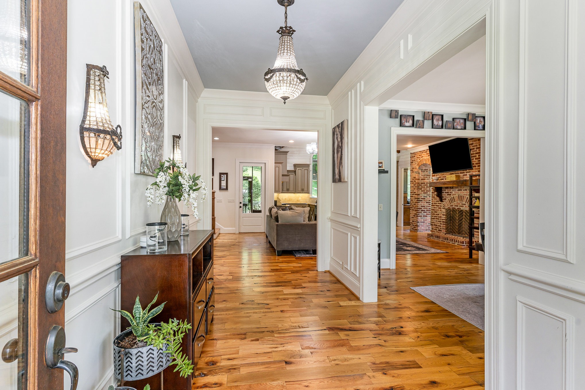4289 Peytonsville-Trinity Road Franklin, TN 37064 - Photo 17 of 67 a hallway with dining area and chandelier