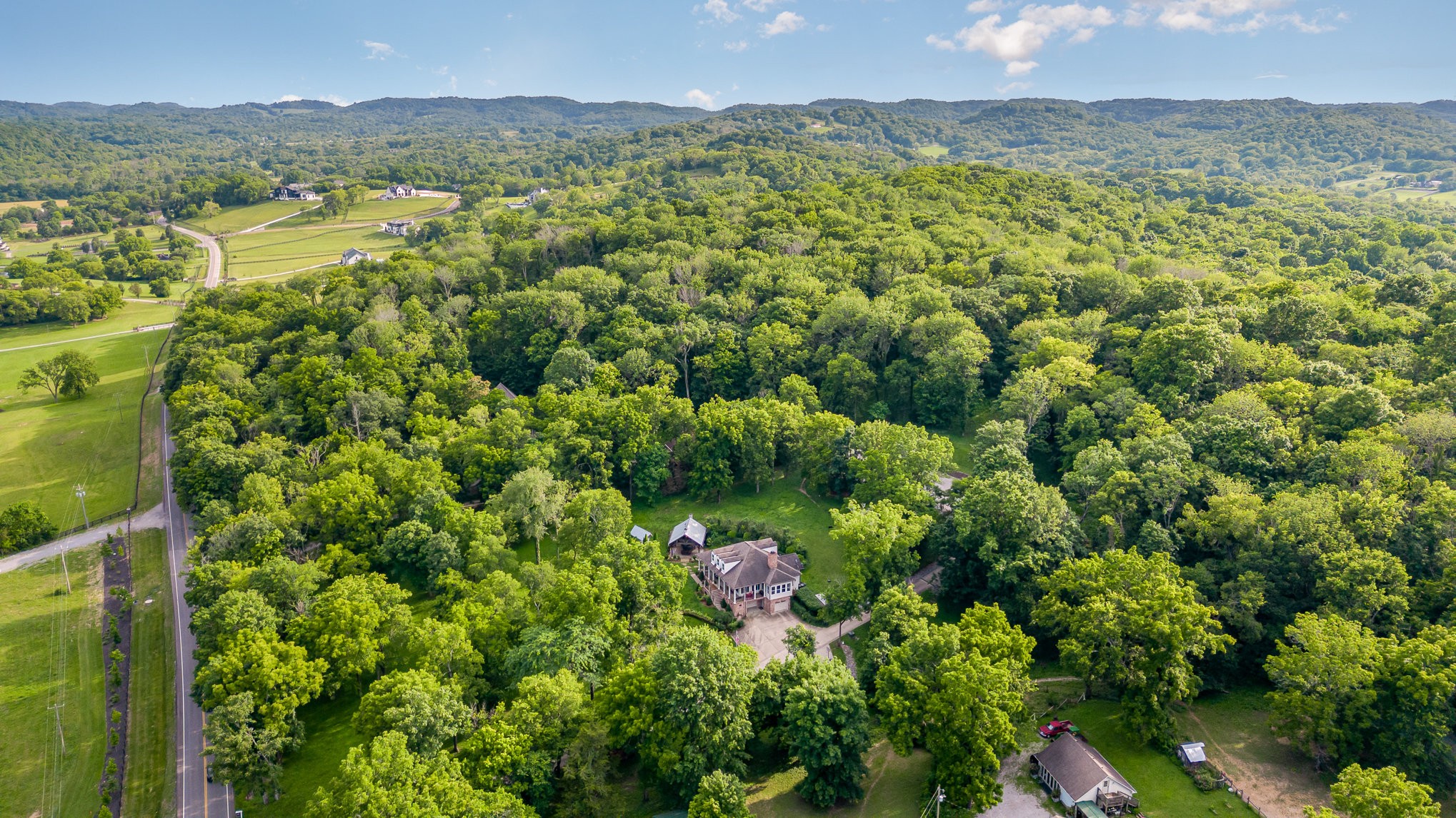 4289 Peytonsville-Trinity Road Franklin, TN 37064 - Photo 62 of 67 a view of a lush green forest with mountains in the background