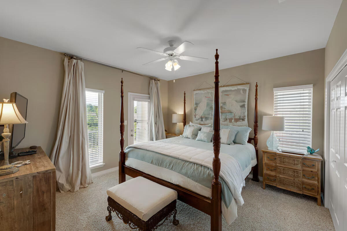 4192 East County Highway 30A, Unit A Santa Rosa Beach, FL 32459 - Photo 11 of 30 a bedroom with a bed desk and a flat screen tv