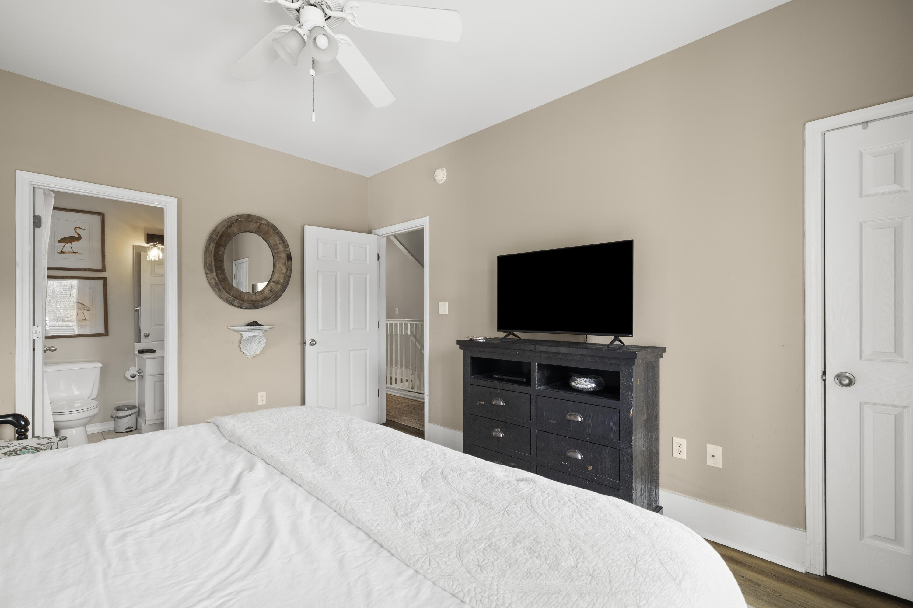 4192 East County Highway 30A, Unit A Santa Rosa Beach, FL 32459 - Photo 21 of 30 a bedroom with a bed and a flat screen tv