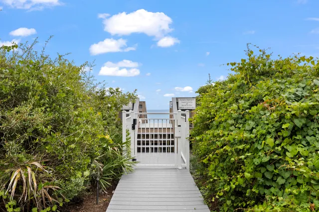 a view of a balcony with wooden fence
