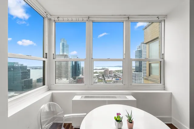 a view of a living room with a large window