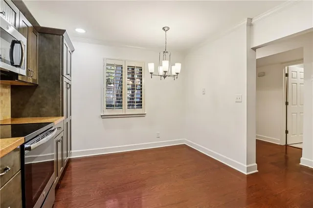 an empty room with windows and entrance