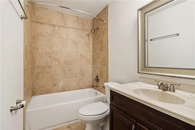 a bathroom with a sink a toilet and a bathtub