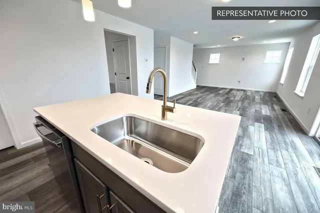 a kitchen with a sink and a stove