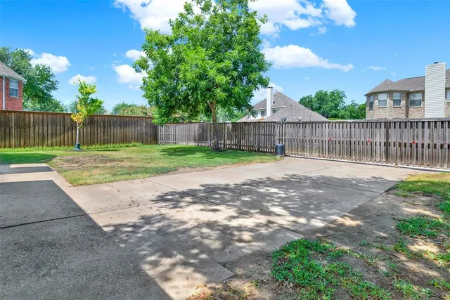 a view of a yard with a swing