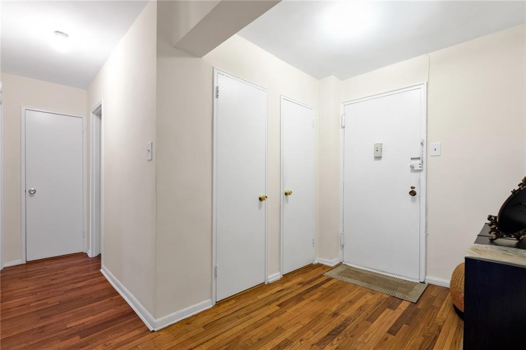 2155 82nd Street, Unit 3J Brooklyn, NY 11214 - Photo 14 of 15 a bedroom with a bed and wooden floor