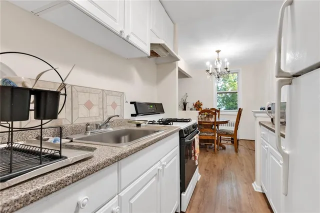 a kitchen with sink cabinets and outdoor living space