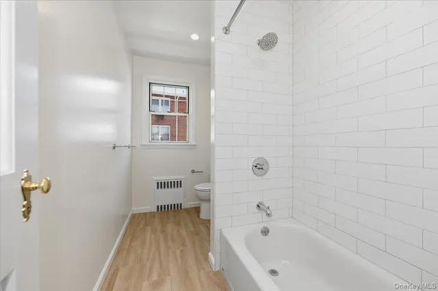 a bathroom with a bathtub and shower