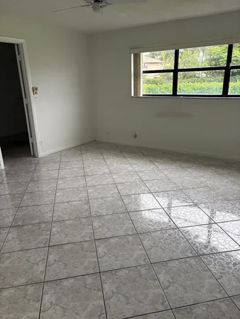a view of a room with wooden floor and cabinet