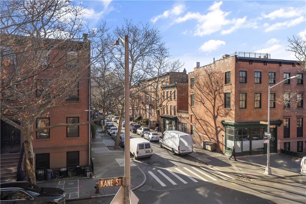 151 Kane Street Brooklyn, NY 11201 - Photo 9 of 14 a city street lined with tall buildings