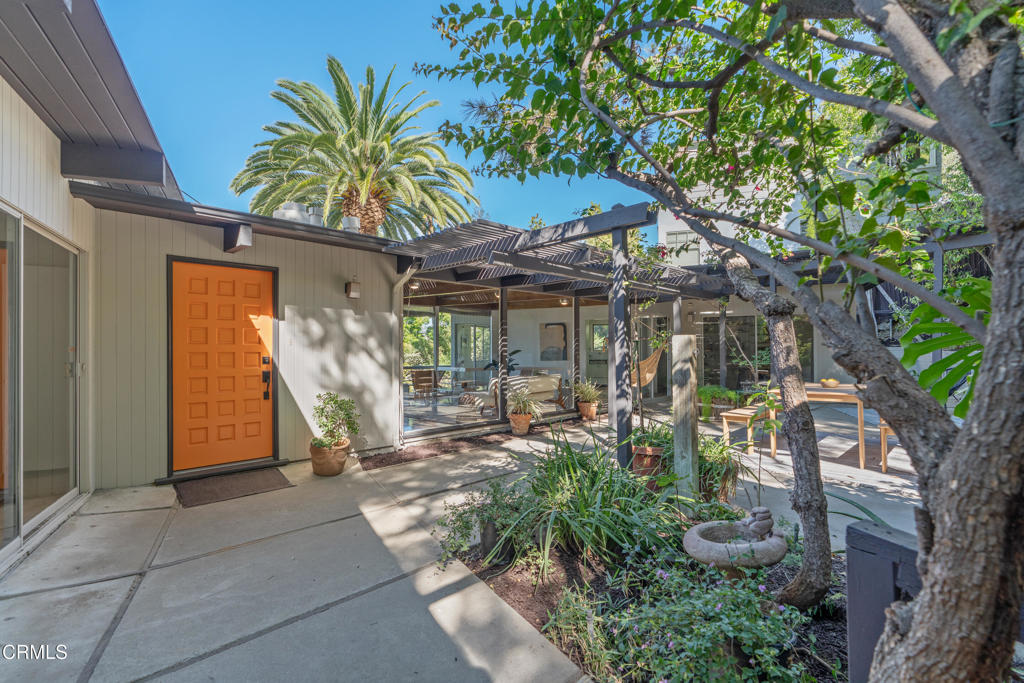 1959 Lucile Avenue Los Angeles, CA 90039 - Photo 3 of 49 a view of a lounge chair with potted plants in front of it