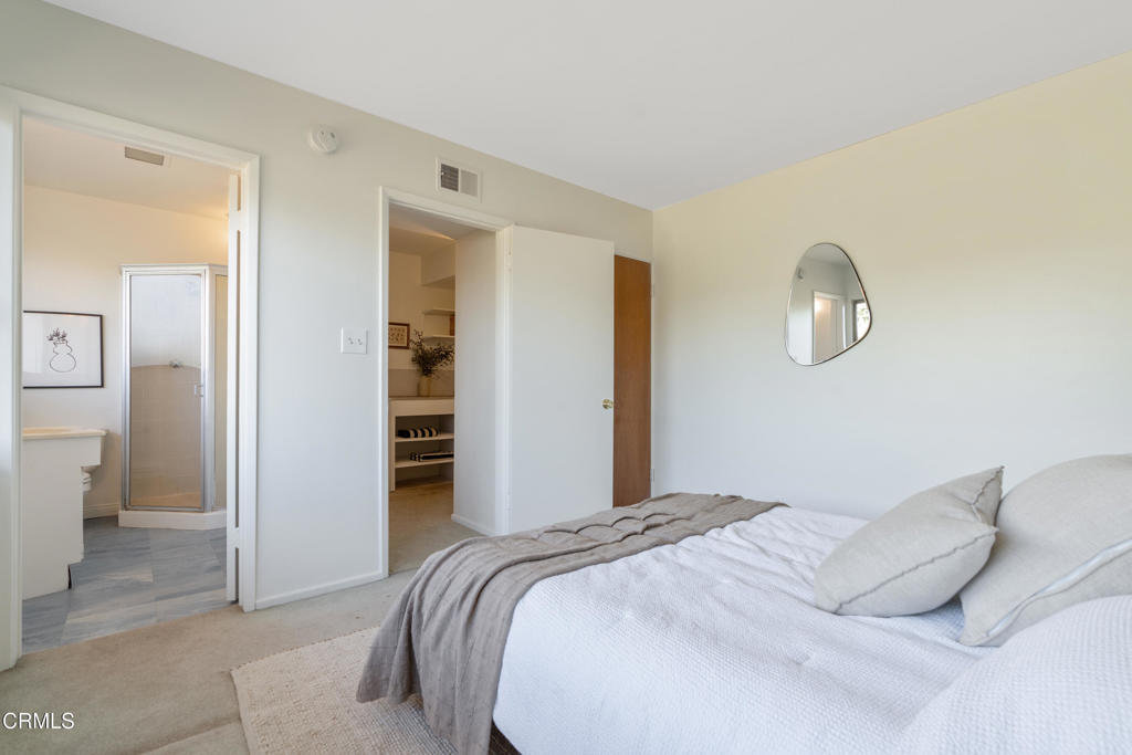 1959 Lucile Avenue Los Angeles, CA 90039 - Photo 31 of 49 a bedroom with a bed and a lamp