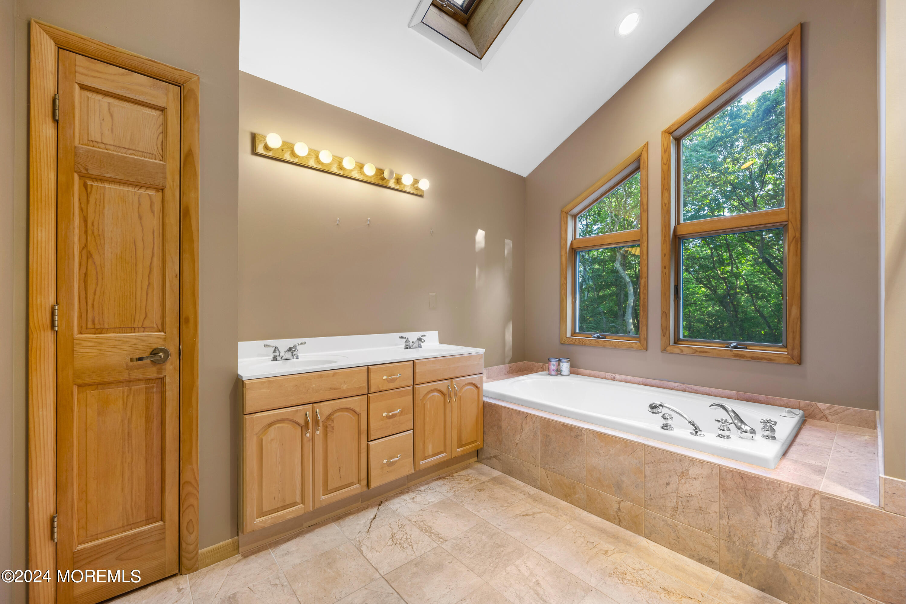 418 Stagecoach Road Millstone Township, NJ 08510 - Photo 19 of 43 a bathroom with a tub sink and mirror