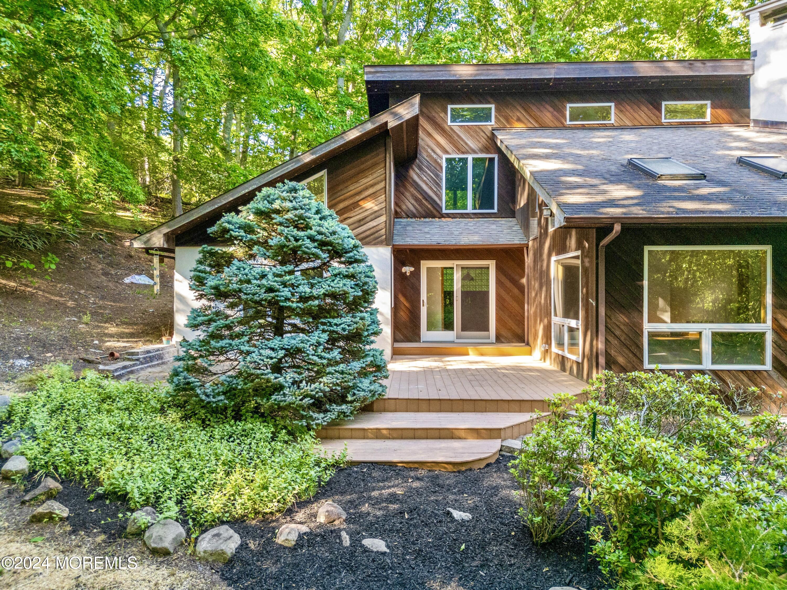 418 Stagecoach Road Millstone Township, NJ 08510 - Photo 2 of 43 a front view of a house with garden