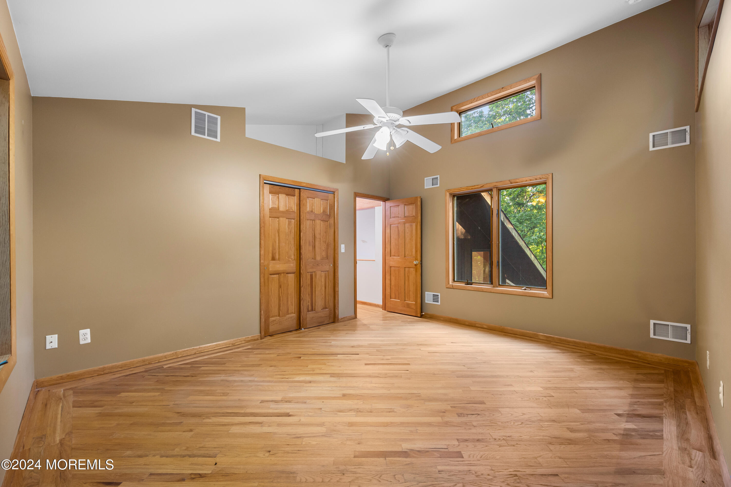 418 Stagecoach Road Millstone Township, NJ 08510 - Photo 23 of 43 a view of an empty room with window and a ceiling fan