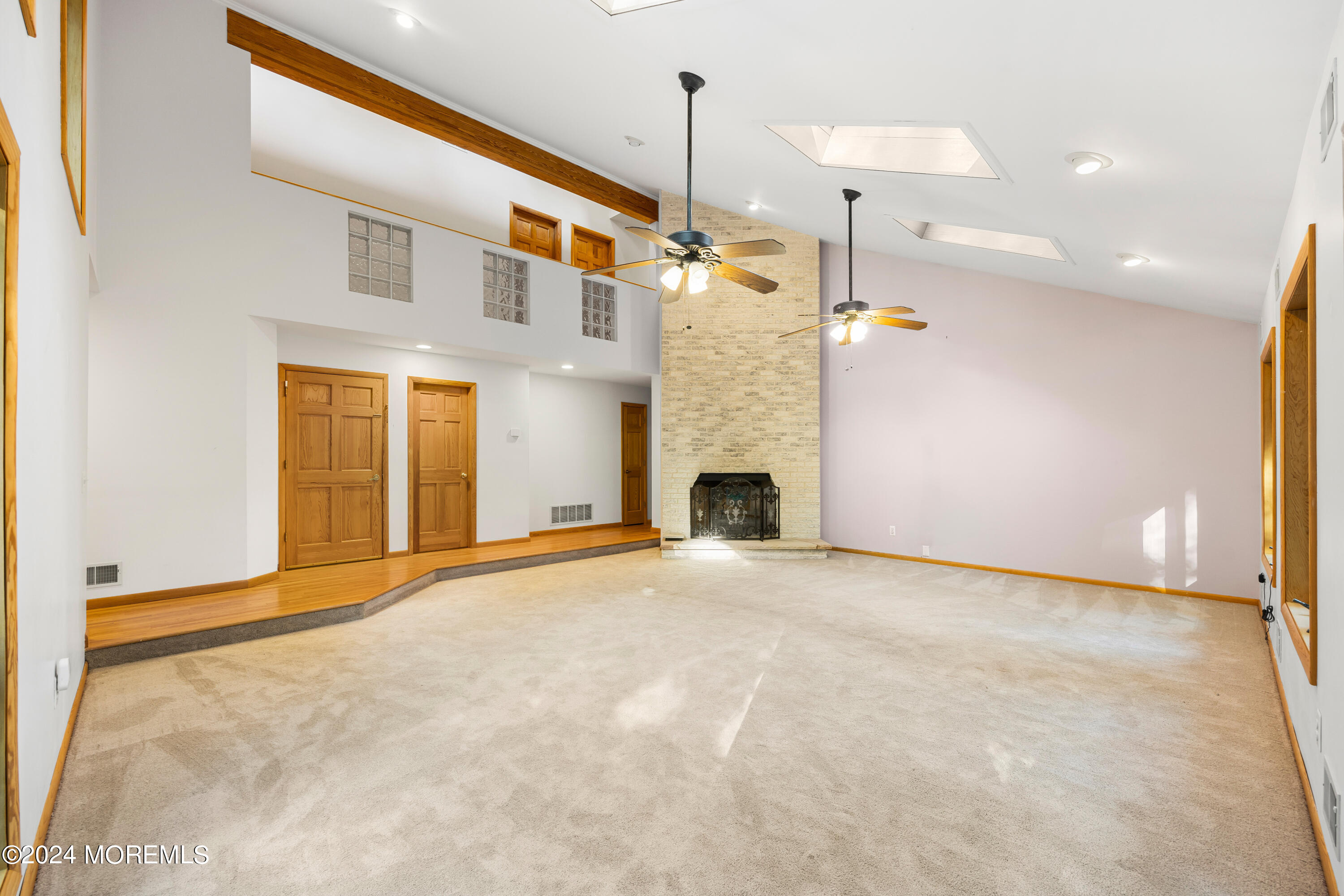 418 Stagecoach Road Millstone Township, NJ 08510 - Photo 25 of 43 a view of an empty room with a fireplace