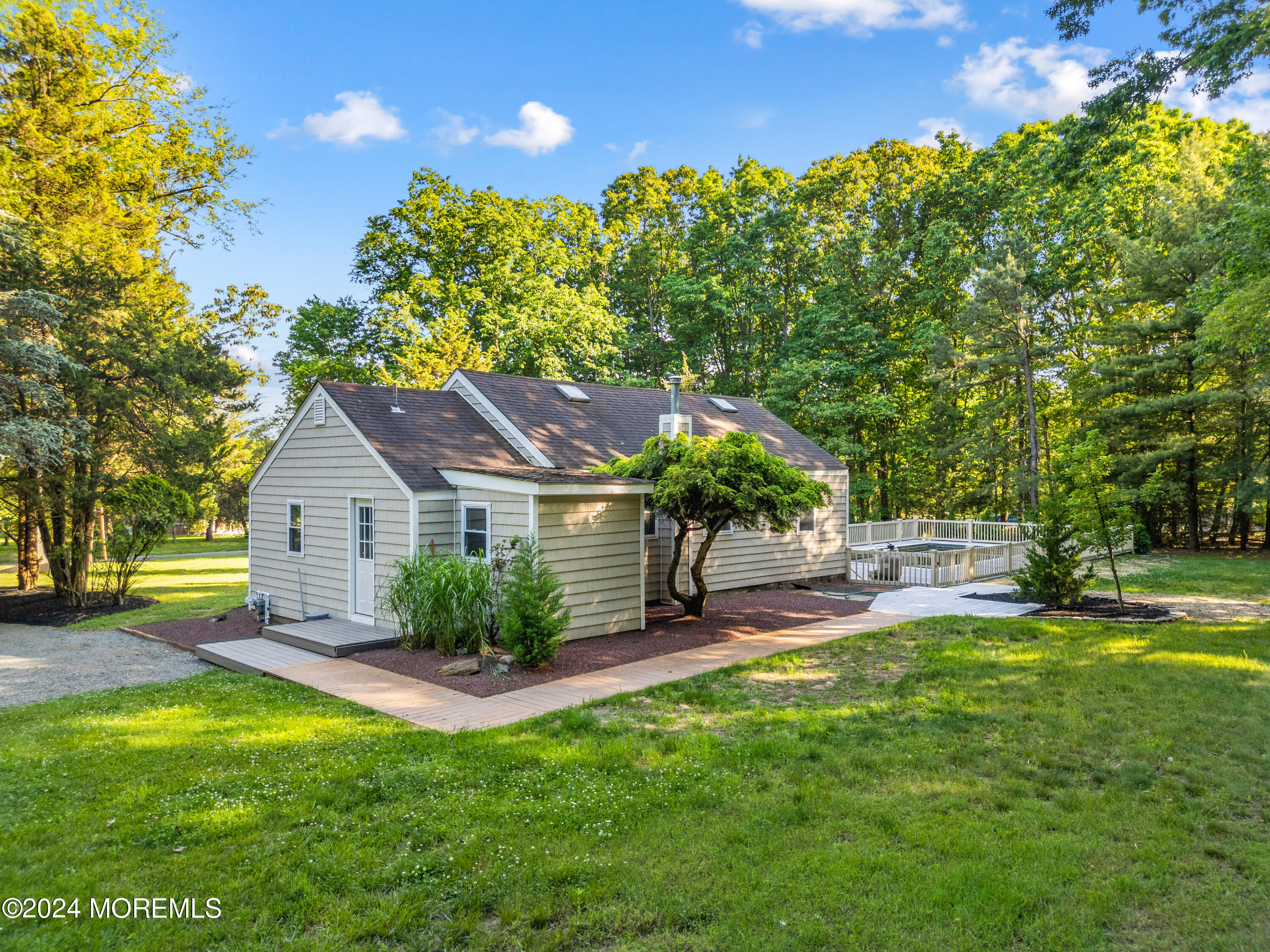 418 Stagecoach Road Millstone Township, NJ 08510 - Photo 28 of 43 a front view of a house with garden