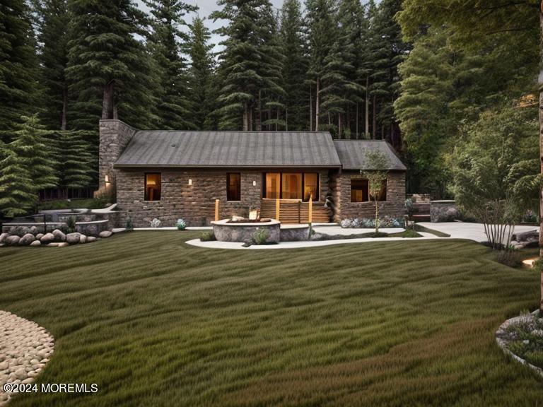 418 Stagecoach Road Millstone Township, NJ 08510 - Photo 43 of 43 a front view of a house with swimming pool having outdoor seating