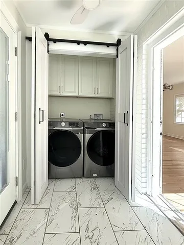 a room with a stove and a refrigerator