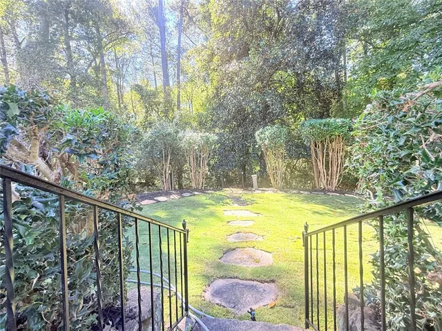 a view of swimming pool from a balcony