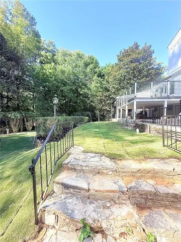 a view of a swimming pool with a porch