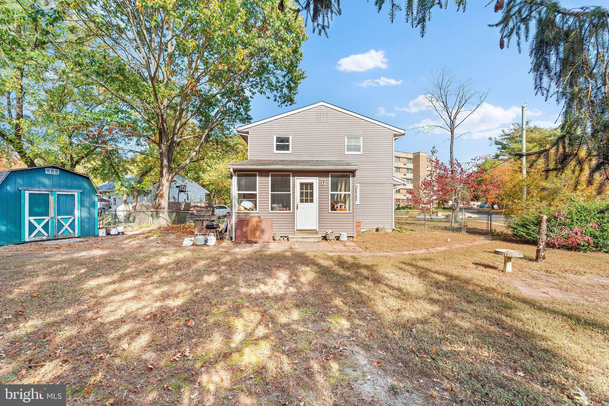 700 Elizabeth Avenue Lindenwold, NJ 08021 - Photo 24 of 29 a front view of a house with a yard and garage